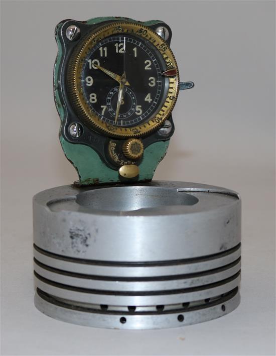 A Messerschmitt cockpit timepiece, numbered 30600, mounted on a piston head, 5.25in.